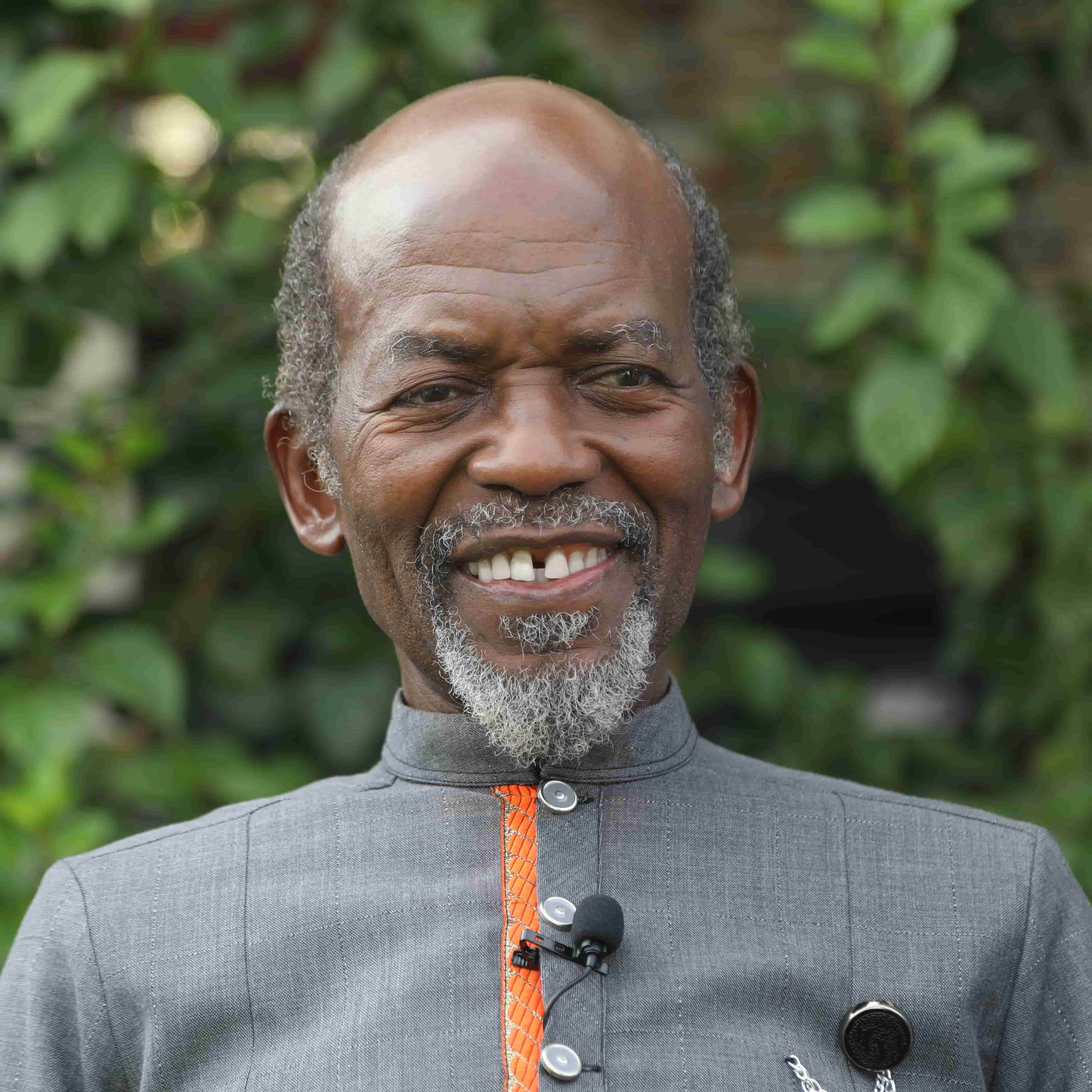 Dr. Baffour Jan smiling outdoors